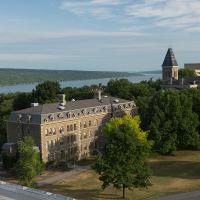 The Arts Quad in summer. With views of Morrill Hall, McGraw Hall and Cayuga Lake.