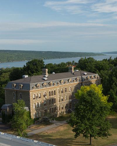 The Arts Quad in summer. With views of Morrill Hall, McGraw Hall and Cayuga Lake.