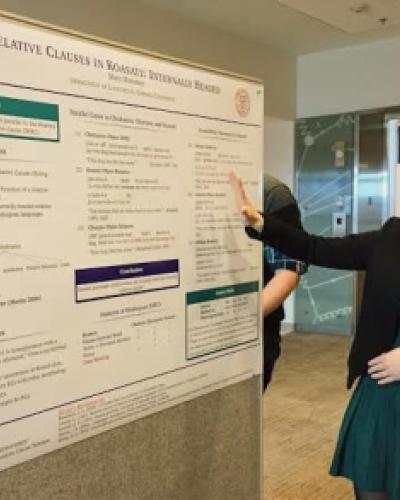 Mary Moroney presenting a poster with her research
